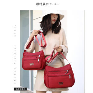 Bolso de hombro de moda, bolso de mujer de tela de nailon simple para mujer, bolso bandolera de gran capacidad, lujo ligero, bolso cambiador de mediana edad de alta gama
