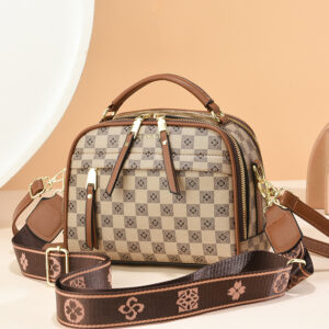 Bolso de mujer popular 2025 nueva de alta gama de moda, bolso redondo de mano estilo extranjero clásico.
